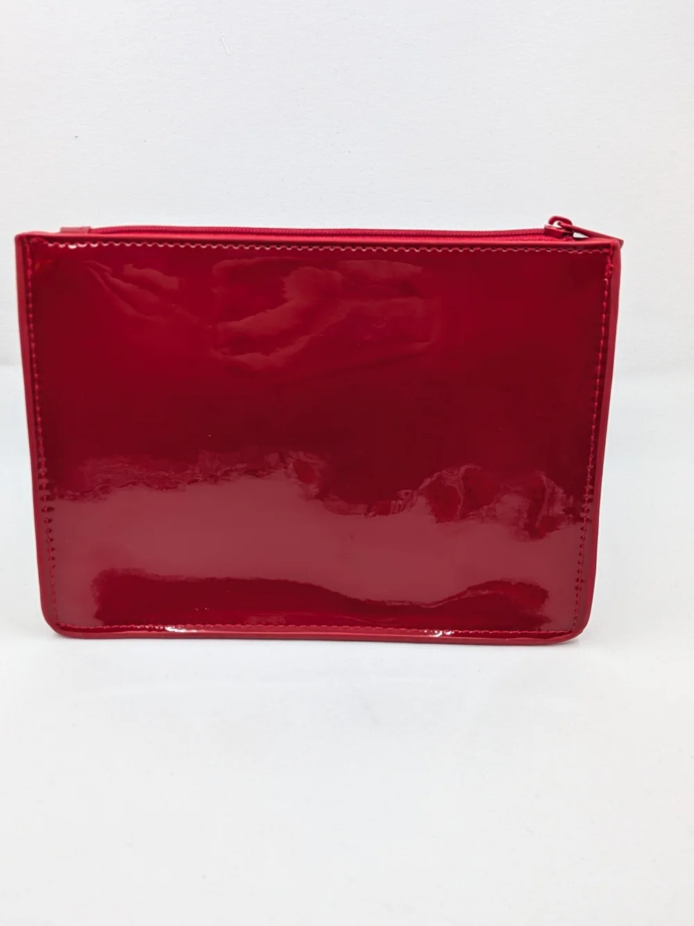 Red Patent Cosmetic Pouch — Designer Embossed Logo
